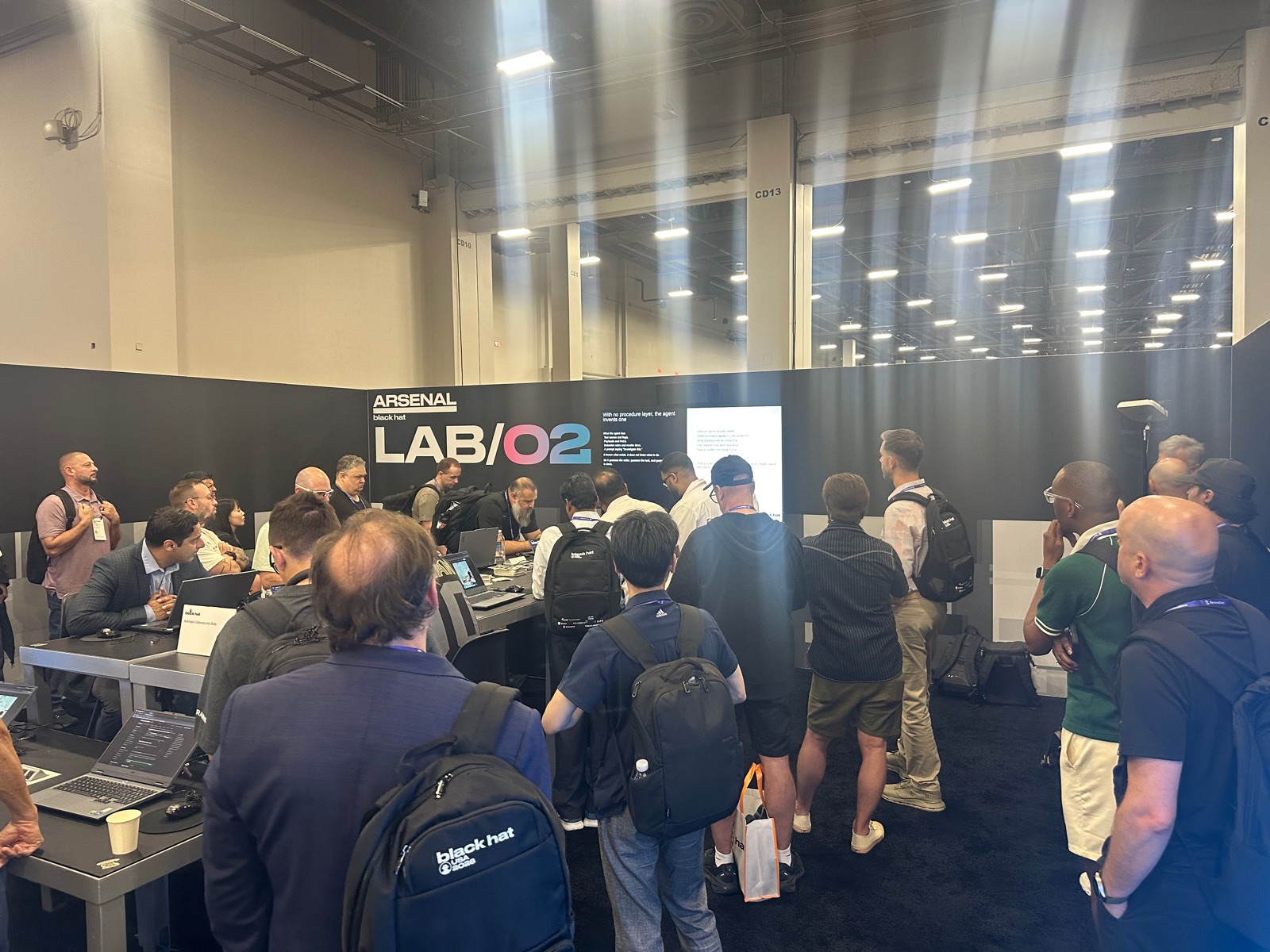 Standing-room crowd at the Casky Black Hat Arsenal booth, LAB/02
